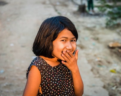 Little native girl smiling mischievously