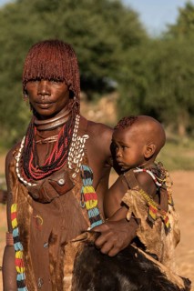 Woman with baby from the Hamer tribe in traditional dress