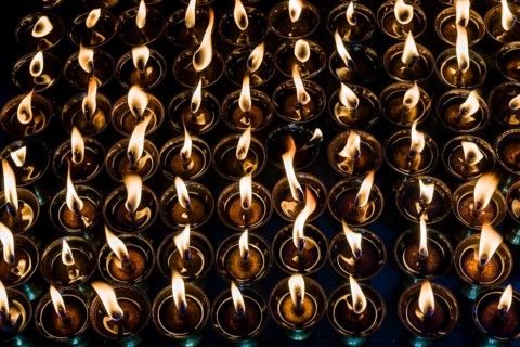 Tibetan butter lamps with burning flames
