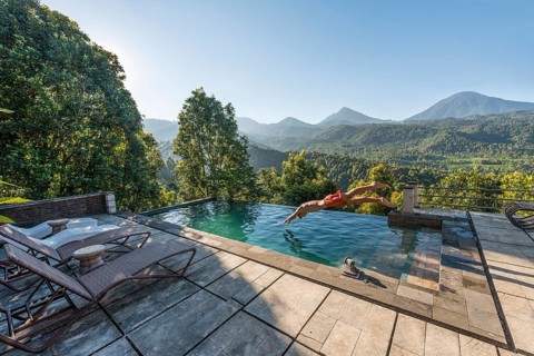 Man jumps into a swimming pool