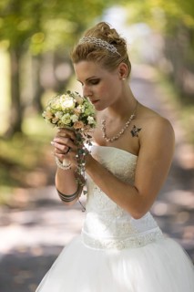 Young blonde woman in a white wedding dress