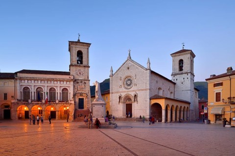 Palazzo Comunale Town Hall and Basilica di San Benedetto at twilight