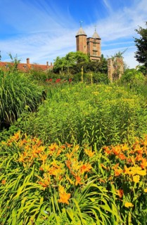 Flowers and red brick tower