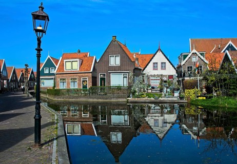 Houses on small channel with water reflection