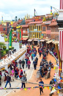 Buddhist pilgrims making the kora or ritual circumnavigation around the Boudhanath Stupa