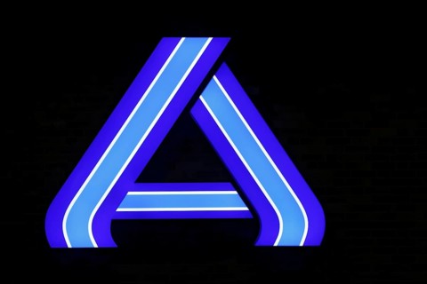 Illuminated company logo sign of the food discounter ALDI Nord