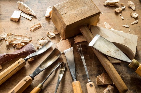 Various woodworking tools on a workbench