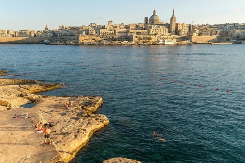 Bathing place on the rocks of Tigne Seafront with city view