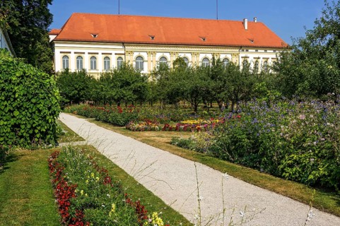 Colorful flower beds and historical orchard