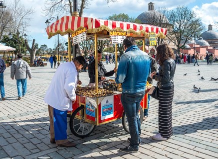 Salesman at his Sweet chestnut stall in Sultan Ahmed Park