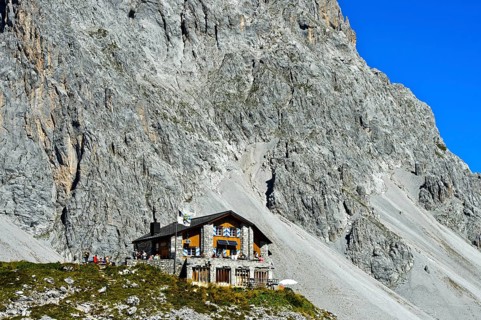 Carschinahutte in front of rock wall of Sulzfluh