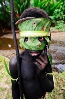 Korafe-child with facial and headdress made of leaves