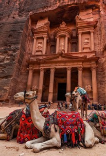 Dromedaries in front of the Pharaoh's treasure house carved out of rock