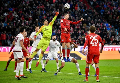 Goalkeeper Fabian Bredlow 1st FC Nuremberg FCN fists ball after corner in front of Robert Lewandowski