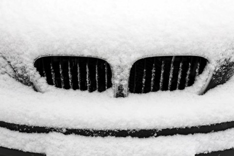 Radiator of a snow-covered BMW