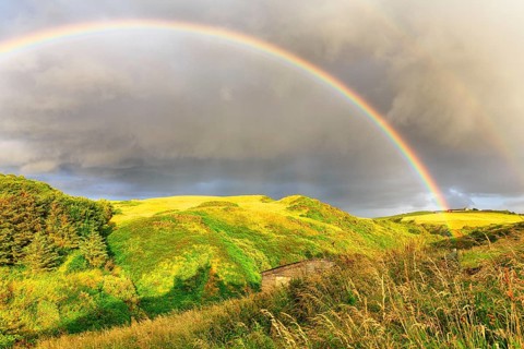 Double rainbow over landscape