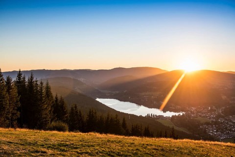 View from Hochfirst to Lake Titisee and Feldberg mountain at sunset