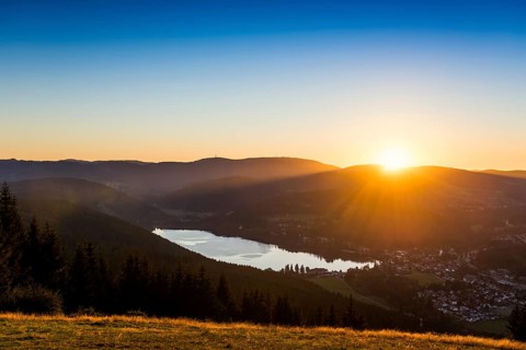 View from Hochfirst to Lake Titisee and Feldberg mountain at sunset