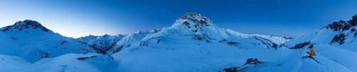 Panorama with tent and view of the mountain Kratzer in winter