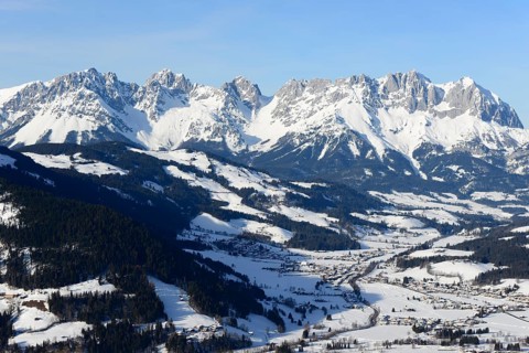 Snow-covered mountain massif Wilder Kaiser in winter with St. Johann in Tyrol