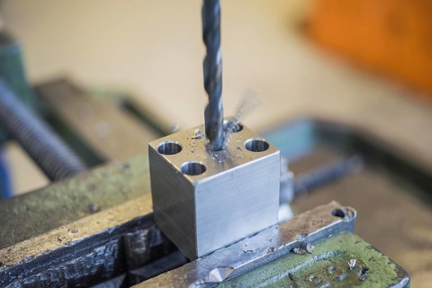 Drilling into a metal workpiece