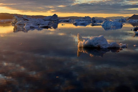 View over the icebergs at midnight sun