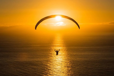 Paraglider over the Atlantic near Puerto Naos during sunset