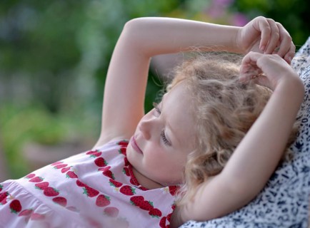 Young girl with blond curly hair