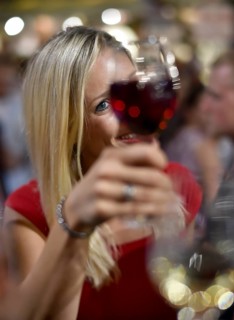 Woman celebrating with wine glass