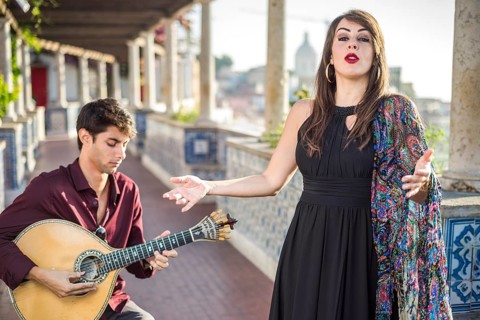 Band performing traditional music fado under pergola with portuguese tiles called azulejos in Lisbon