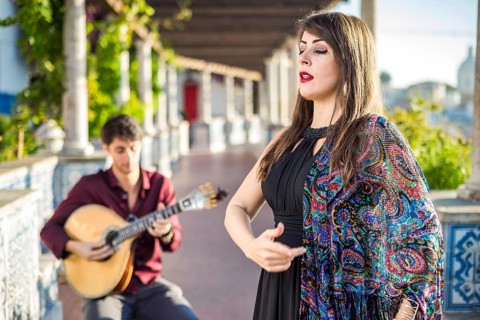 Band performing traditional music fado under pergola with portuguese tiles called azulejos in Lisbon