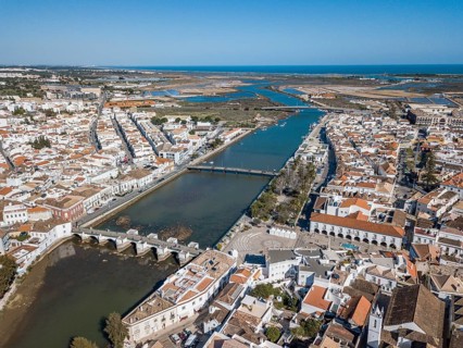 City view with roman bridge over Gilao river in old fishermen's town