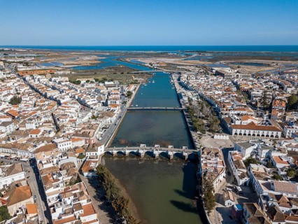 City view with roman bridge over Gilao river in old fishermen's town
