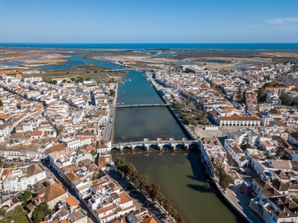 City view with roman bridge over Gilao river in old fishermen's town