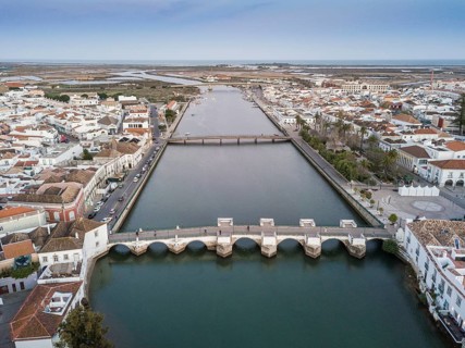City view with roman bridge over Gilao river in old fishermen's town