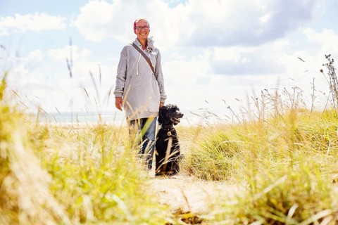 Woman walks with her dog