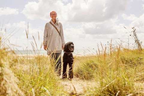 Woman walks with her dog