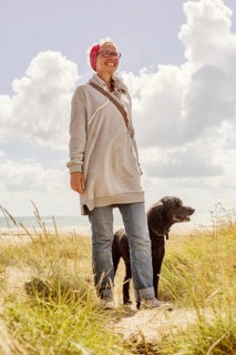 Woman walks with her dog
