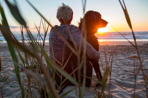 Woman sits with her dog