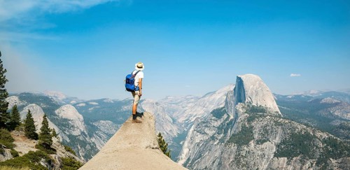 Young man standing on ledge
