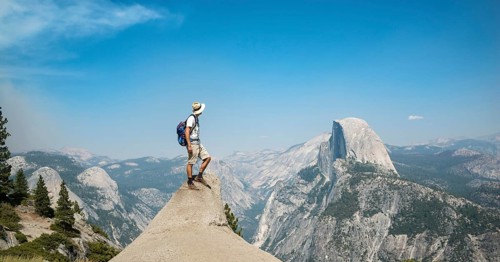 Young man standing on ledge