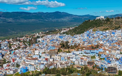 View on blue houses of the medina of Chefchaouen with Kasbah