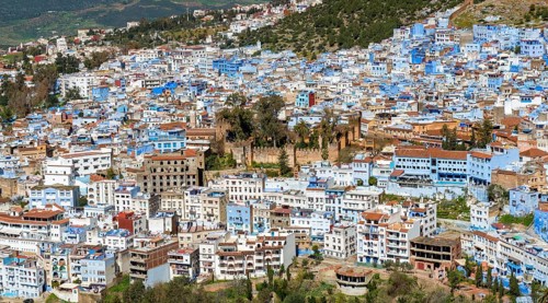 View on blue houses of the medina of Chefchaouen with Kasbah
