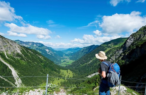 Hiker on the hiking trail from Hinterstein to Schrecksee