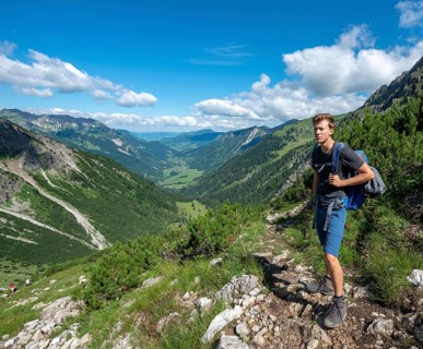 Hiker on the hiking trail from Hinterstein to Schrecksee