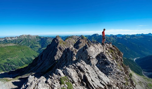 Hiker stands on rocks