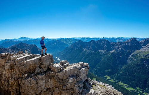 Hiker at the summit of the Hochvogel