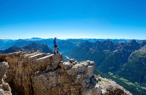 Hiker at the summit of the Hochvogel
