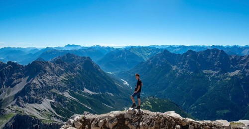 Hiker at the summit of the Hochvogel