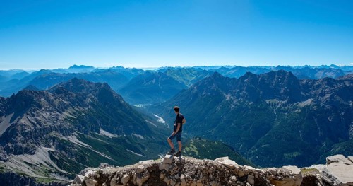 Hiker at the summit of the Hochvogel